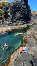 Member jumping into the water at Bushrangers Bay